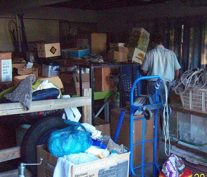 garage with boxes and personal items stacked up