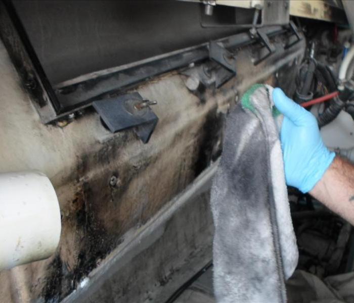 boats engine compartment covered in soot