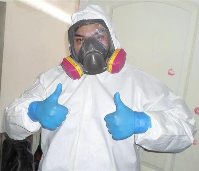 male employee dressed in personal protective equipment