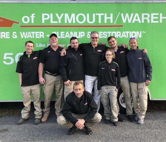 8 SERVPRO employees standing in front of a SERVPRO truck